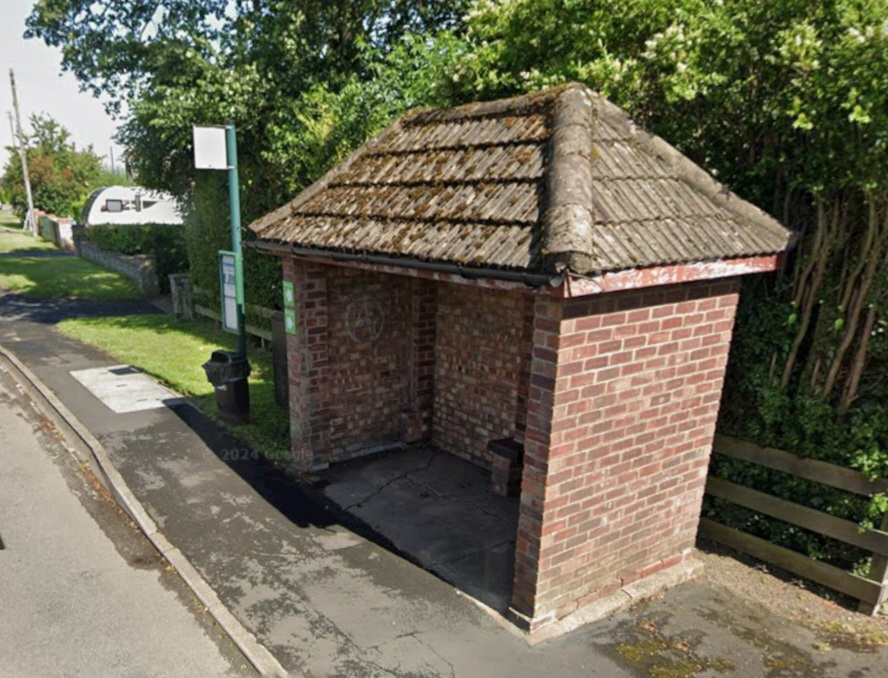 The bus stop a short walk from the gate