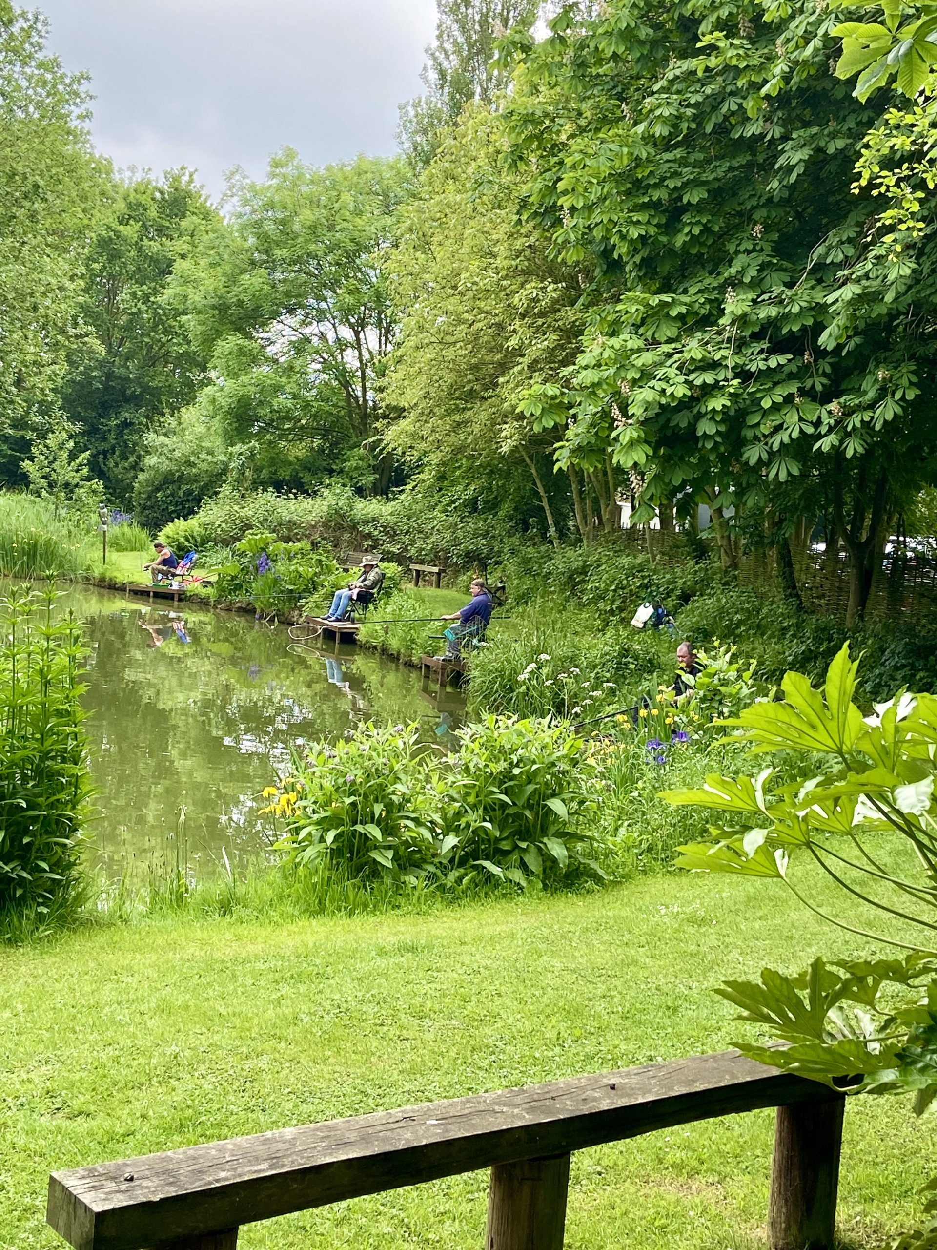 Guests fishing on the lake at Acorn Wood